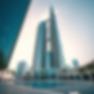 Striking Glass Facade of Etihad Towers in Daylight Exterior shot of the Etihad Towers during the day, illustrating their striking glass facade and modern architecture.